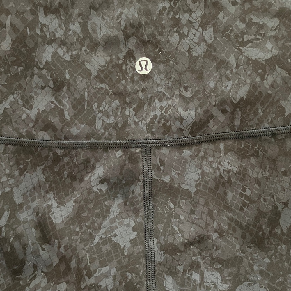 Lululemon wundertrain tight, black snake/floral print, size 4
